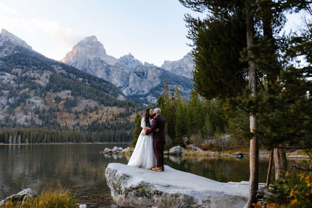 A couple kissing after their wedding ceremony at the Grand Teton National Park