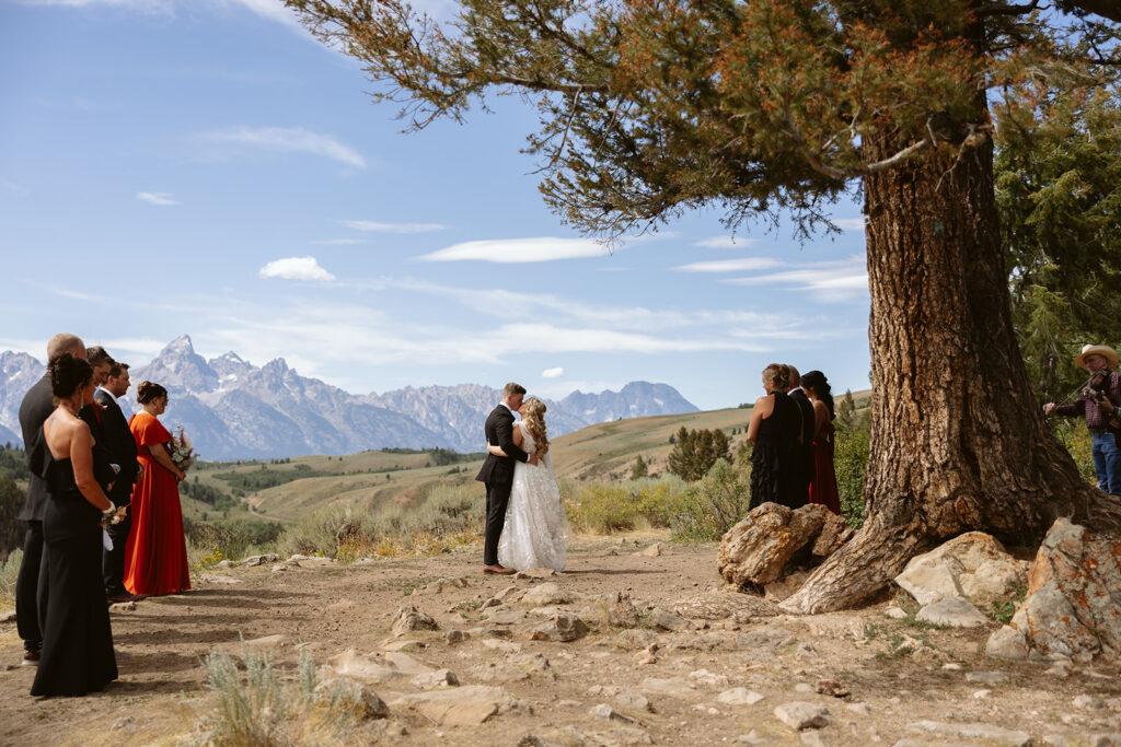A couple sharing their first dance at The Wedding Tree on their wedding day in Jackson Hole, Wyoming.