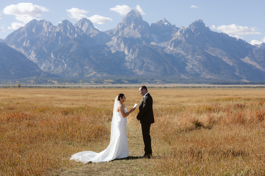 A couple during their elopement ceremony at Mormon Row in Grand Teton National Park
