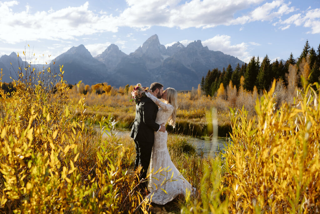 A couple on their wedding day at Schwabacher Landing in Grand Teton National Park