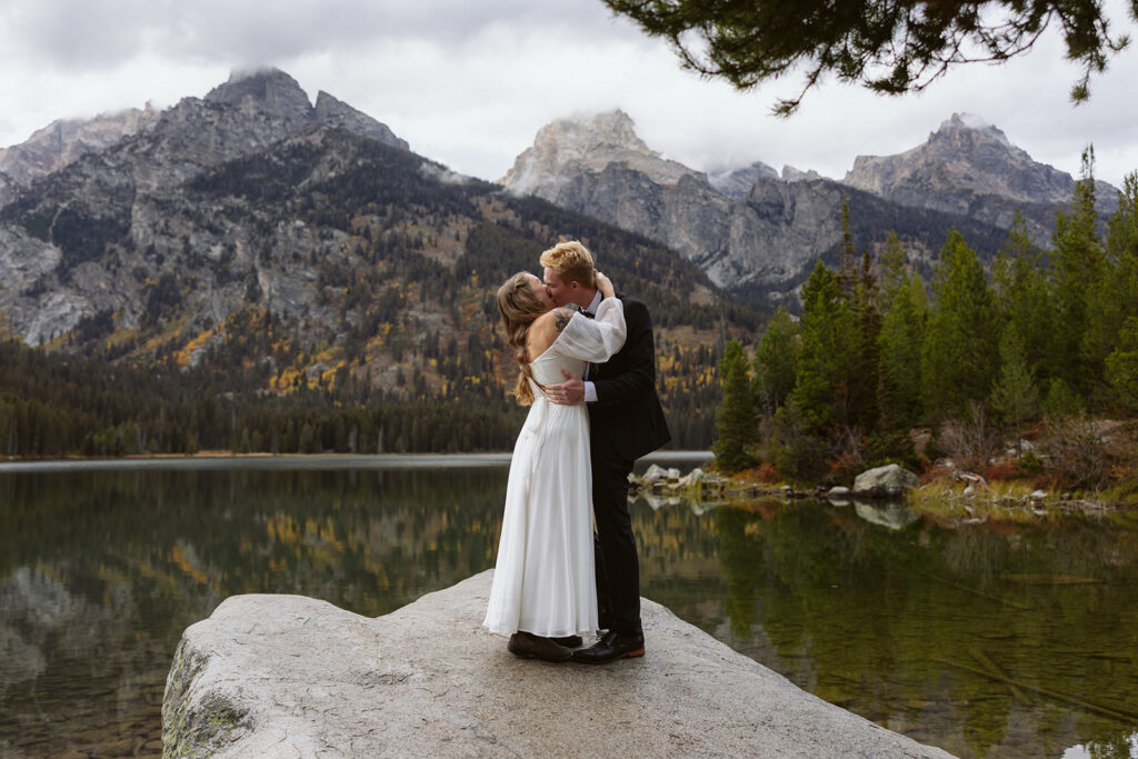 A couple during their elopement ceremony at Taggart Lake in Grand Teton National Park