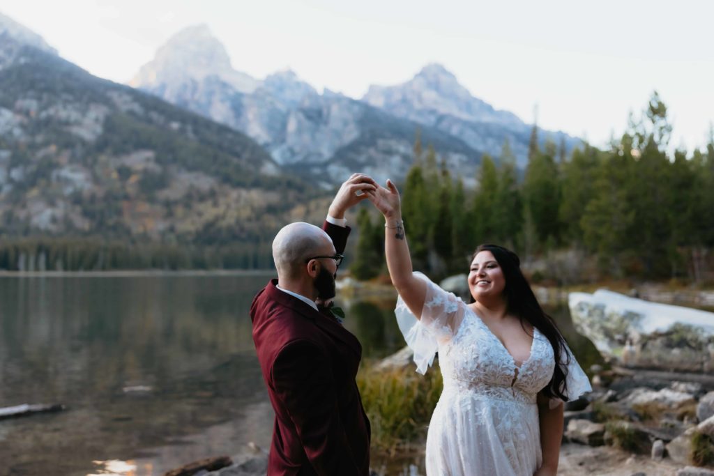 Couple's first dance on the shore of Taggart Lake during their elopement in Grand Teton National Park
