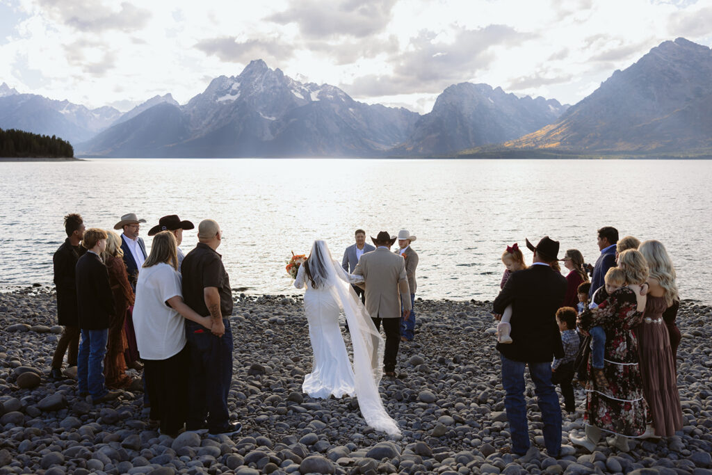 A wedding ceremony at Colter Bay Swim Beach in Grand Teton National Park