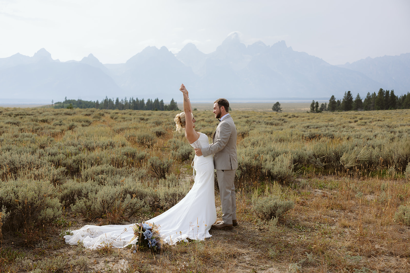 A couple celebrating after their elopement ceremony in Grand Teton National Park